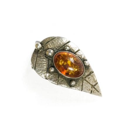 modernist leaf motif brooch in silver and amber