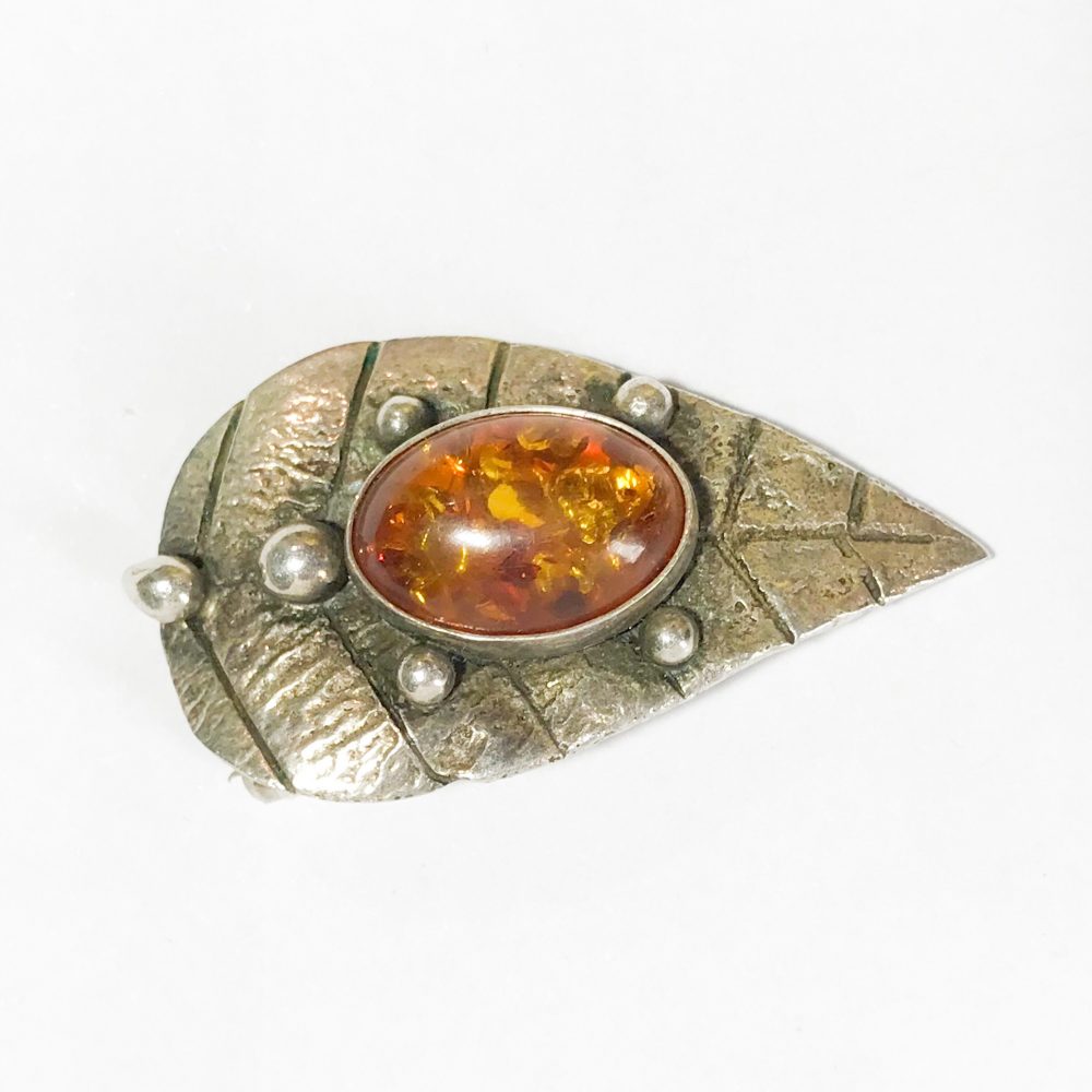 modernist silver brooch with natural amber