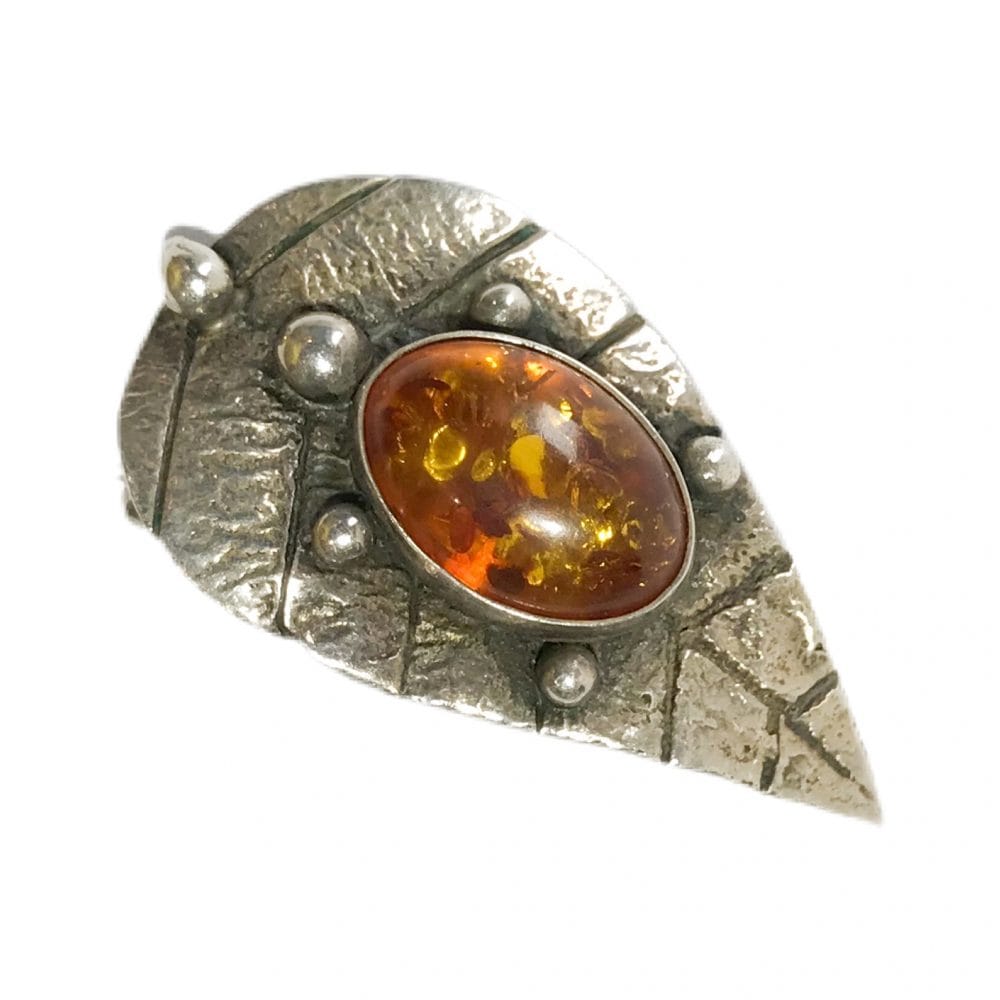 modernist brooch in silver with natural amber