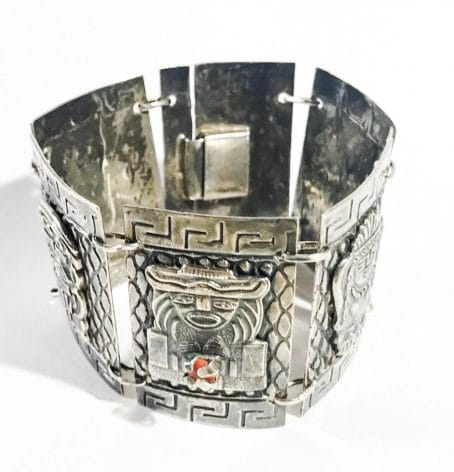 silver and coral antique bracelet with aztec figures