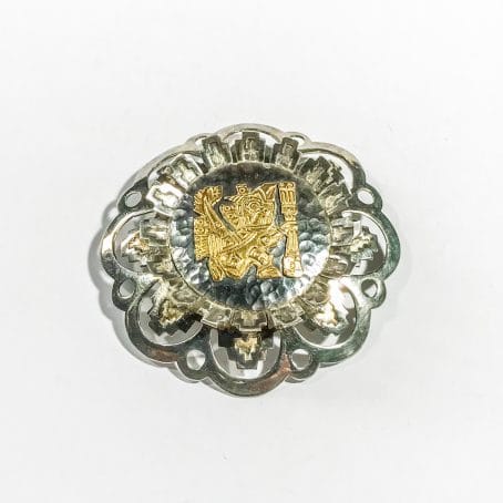 ethnic silver and gold brooch