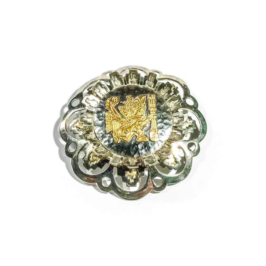 vintage silver brooch with gold Inca decoration