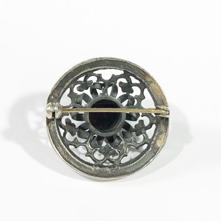 antique solid silver brooch with garnet