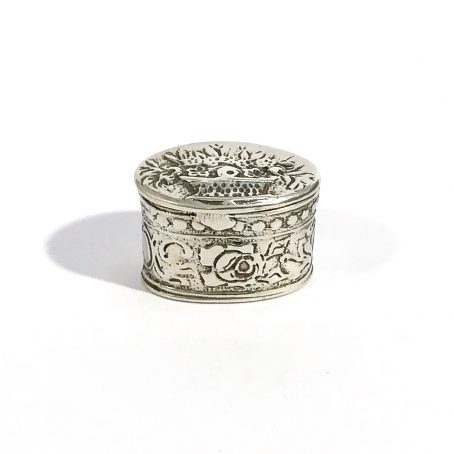 small solid silver pill box with floral decoration, hallmarked 
