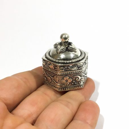 silver ethnic pill box with floral decorations
