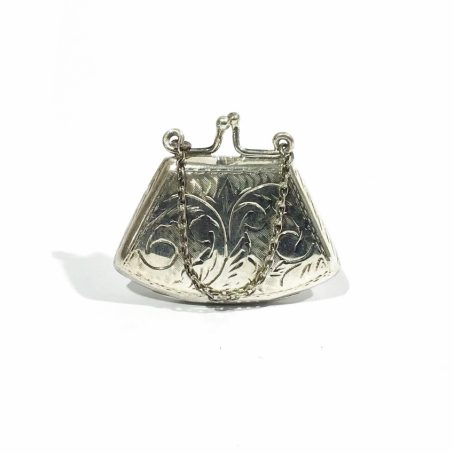 portapillole vintage d’argento a forma di borsetta