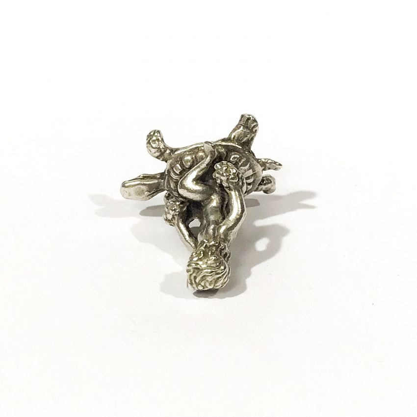 collector’s silver miniature putto on turtle
