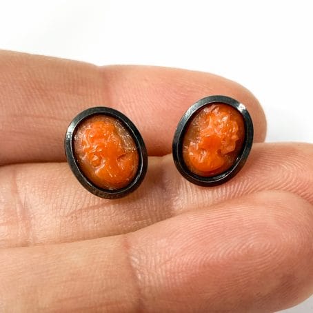 stud earrings with hand carved red coral cameo