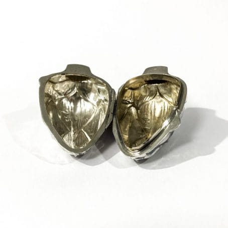 open artichoke shaped pill box