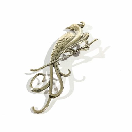 silver pendant brooch in the shape of a phoenix