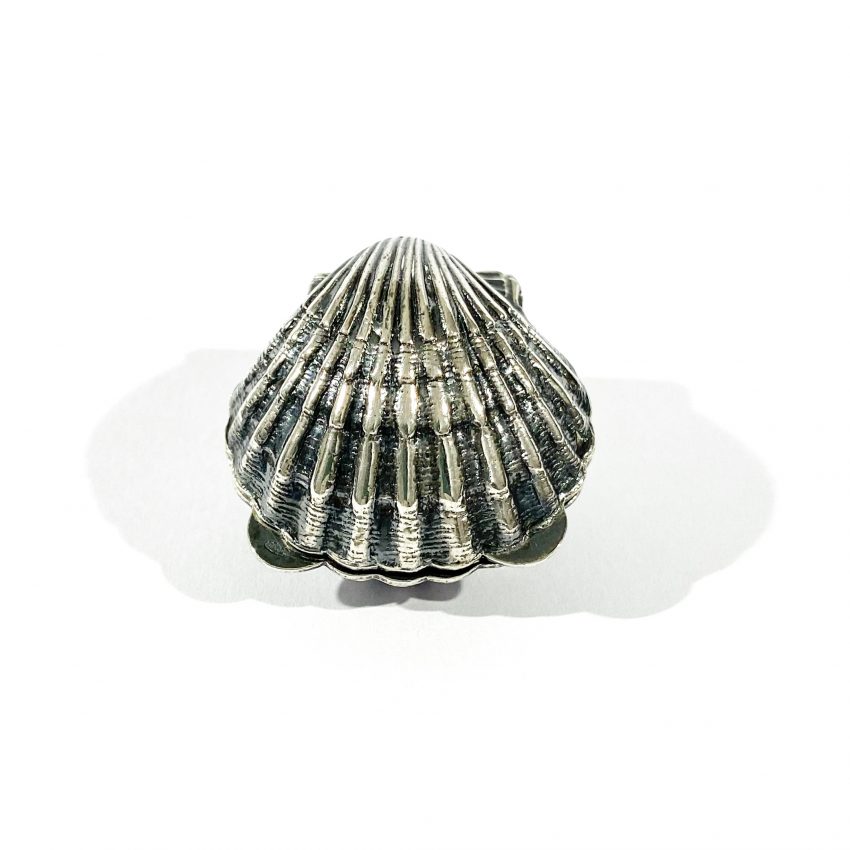 vintage silver pill box in the shape of a shell